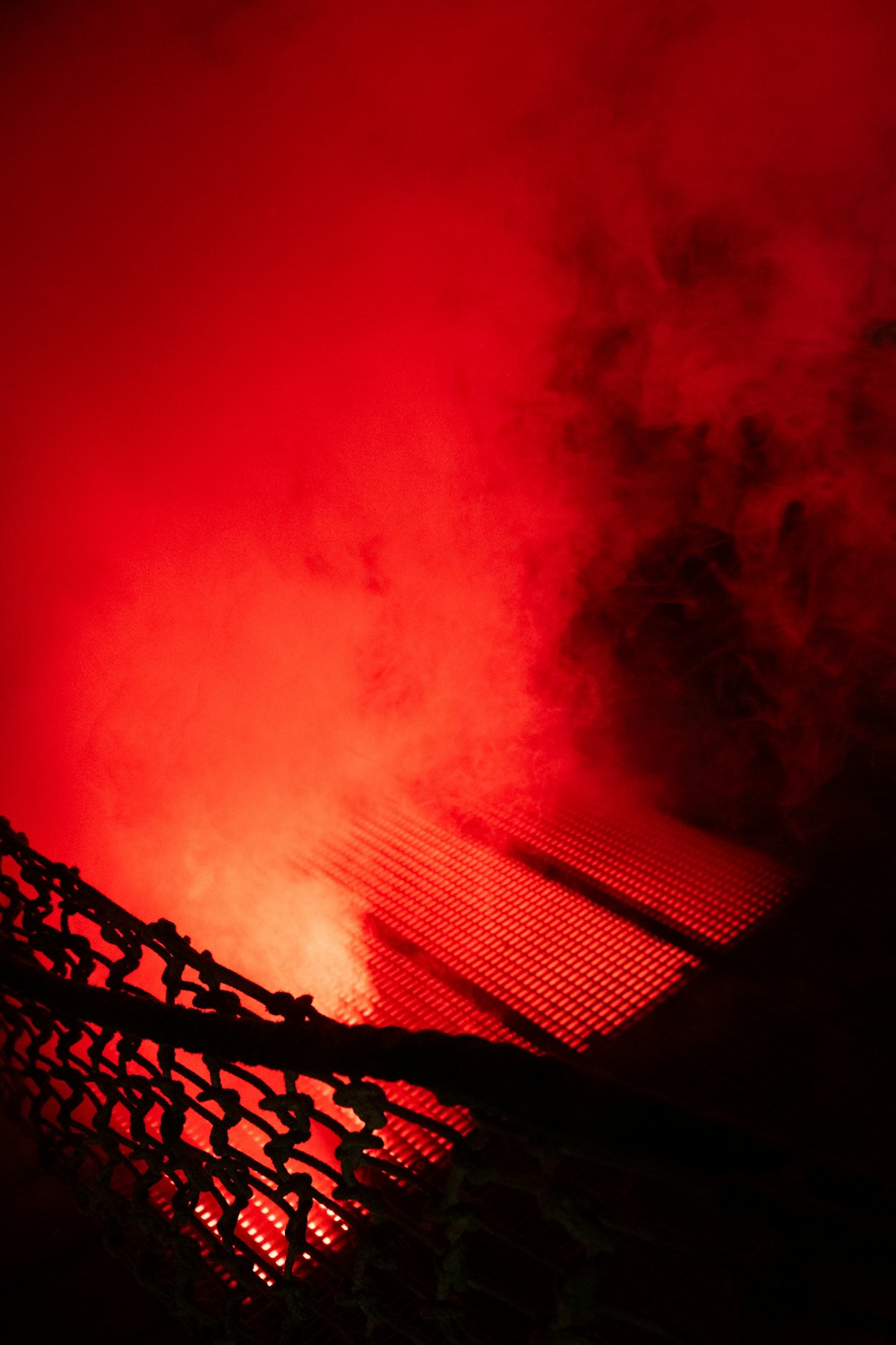 a red light shines on the roof of a building