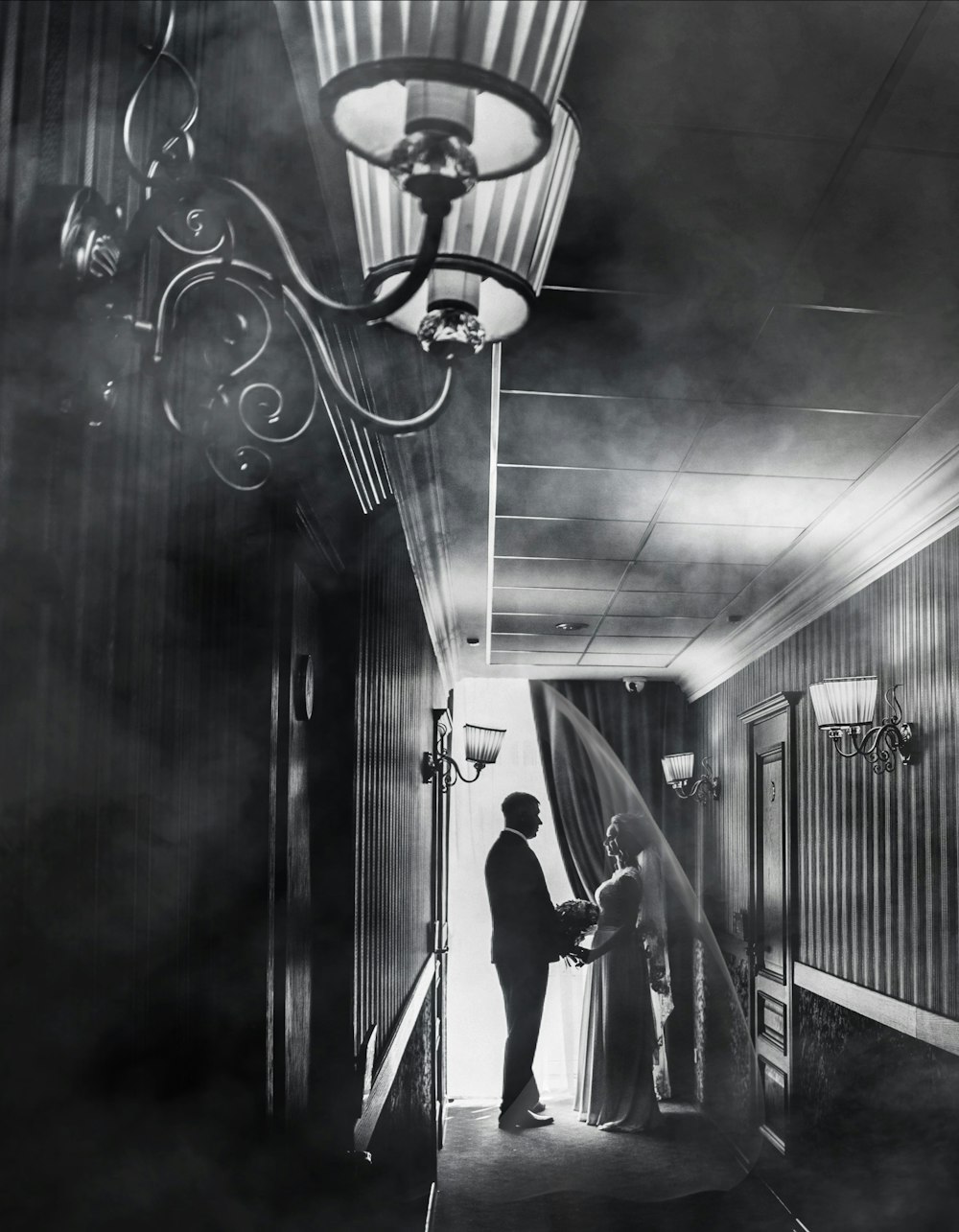 a man and a woman standing in a hallway