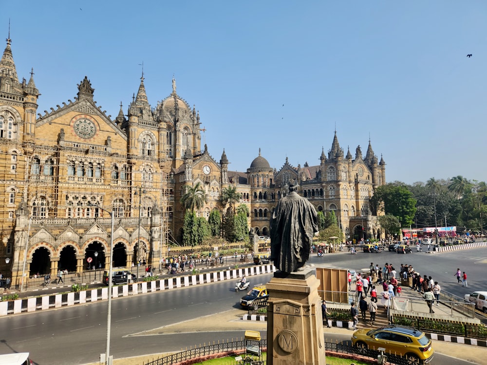 a large building with a statue in front of it