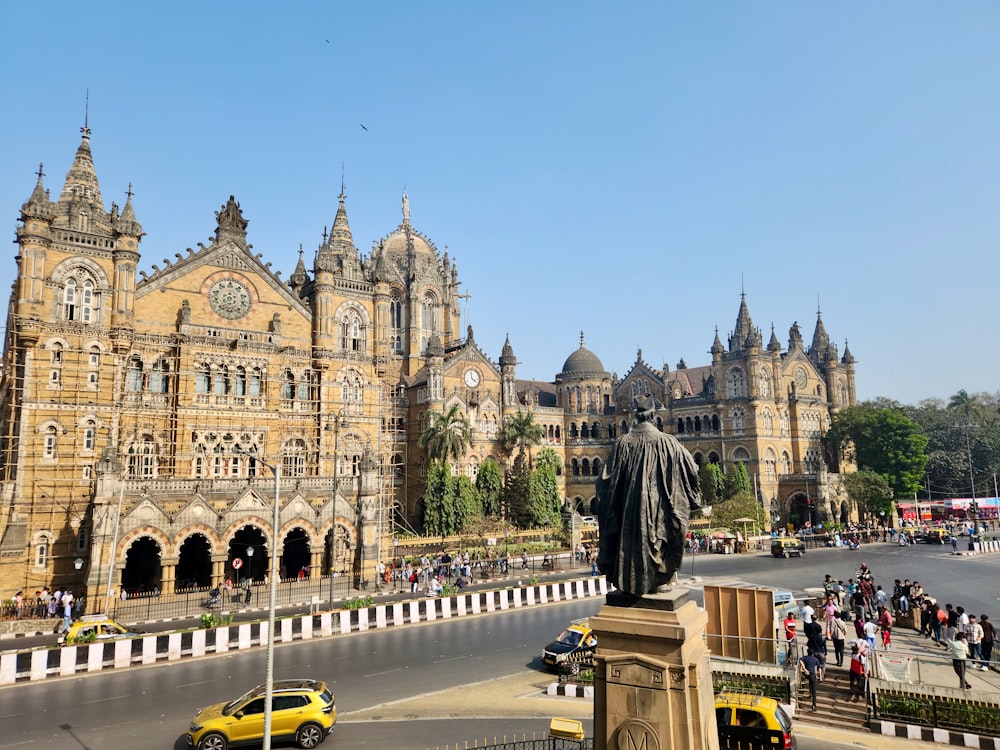 a large building with a statue in front of it