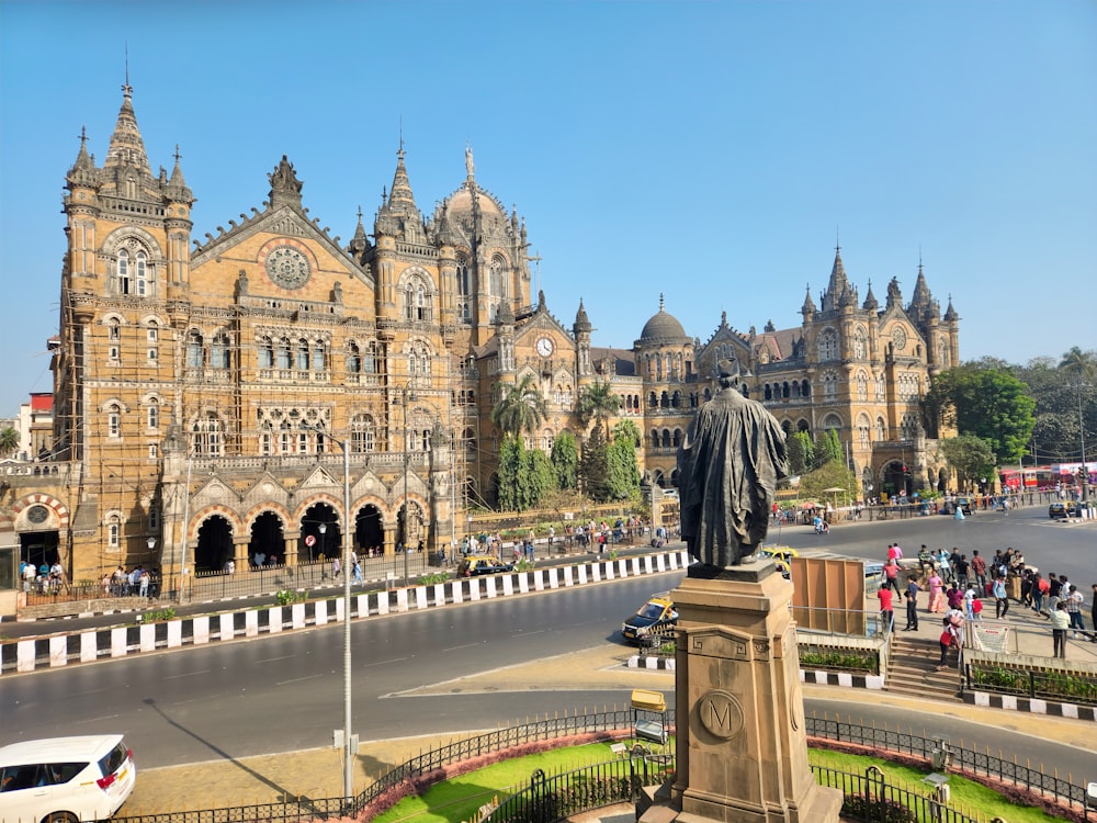 a large building with a statue in front of it