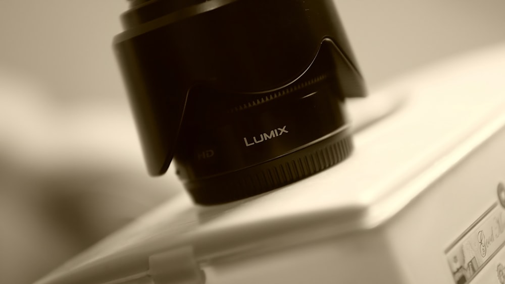 a camera lens sitting on top of a refrigerator