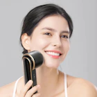 a woman holding a hair dryer in her hand