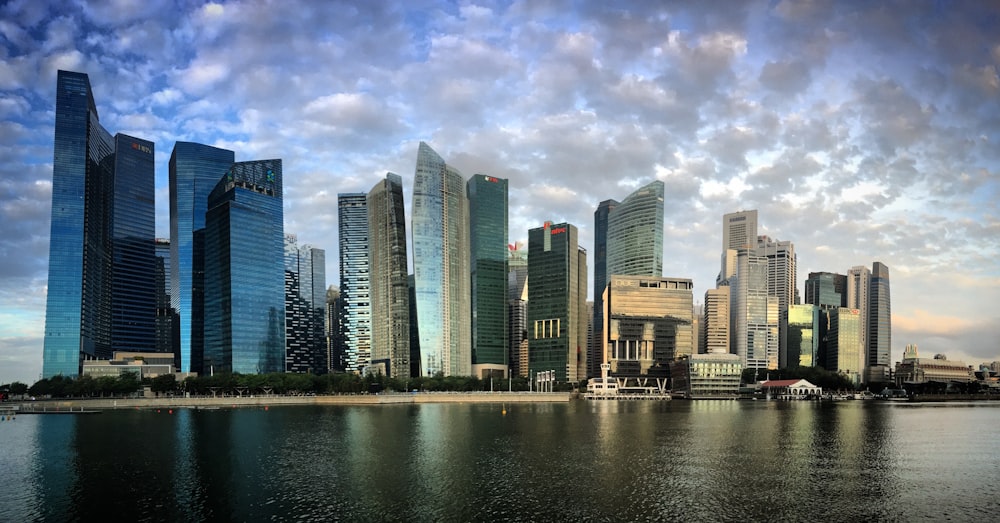 a large body of water with a bunch of tall buildings in the background