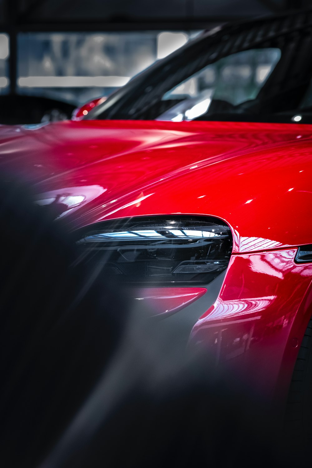 a red sports car parked in a garage