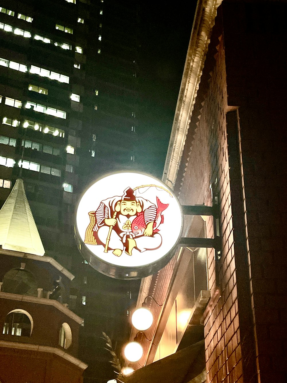 a neon sign hanging from the side of a building