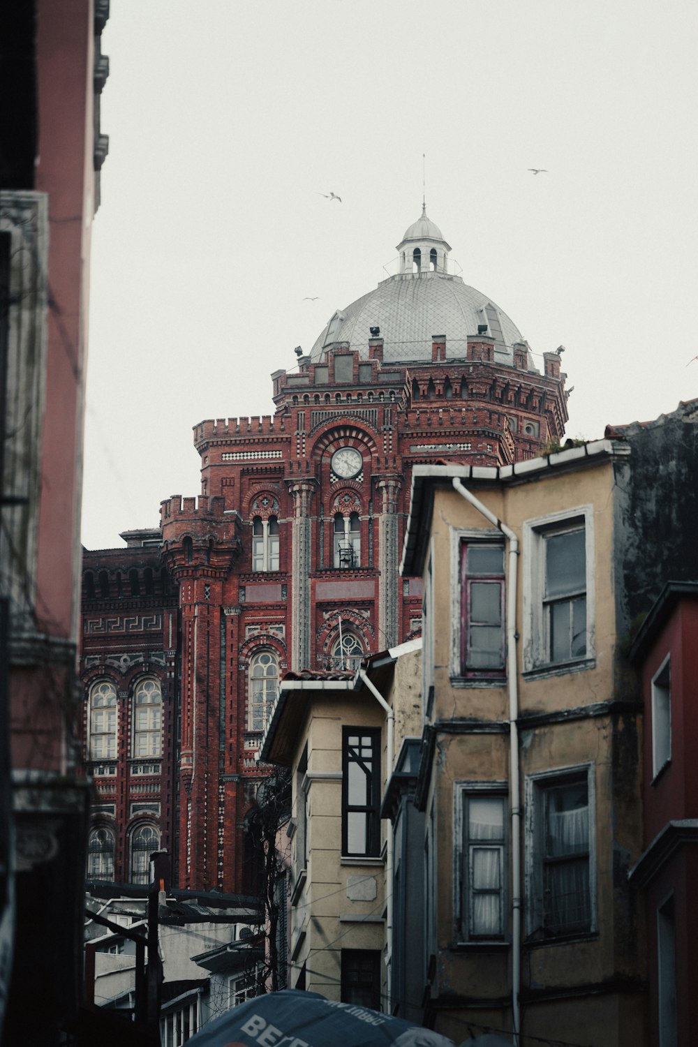 a large building with a clock on the top of it