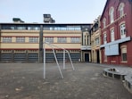 an empty playground in front of a building