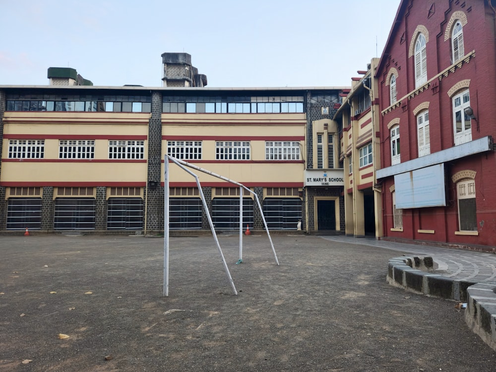 an empty playground in front of a building
