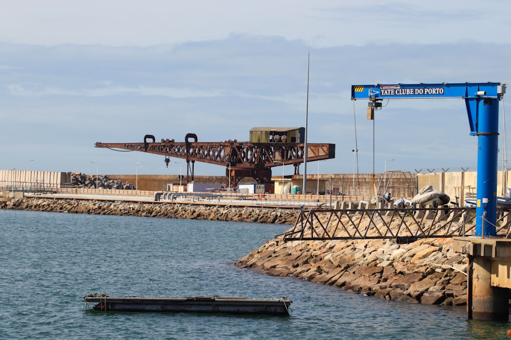 a large crane sitting on top of a body of water