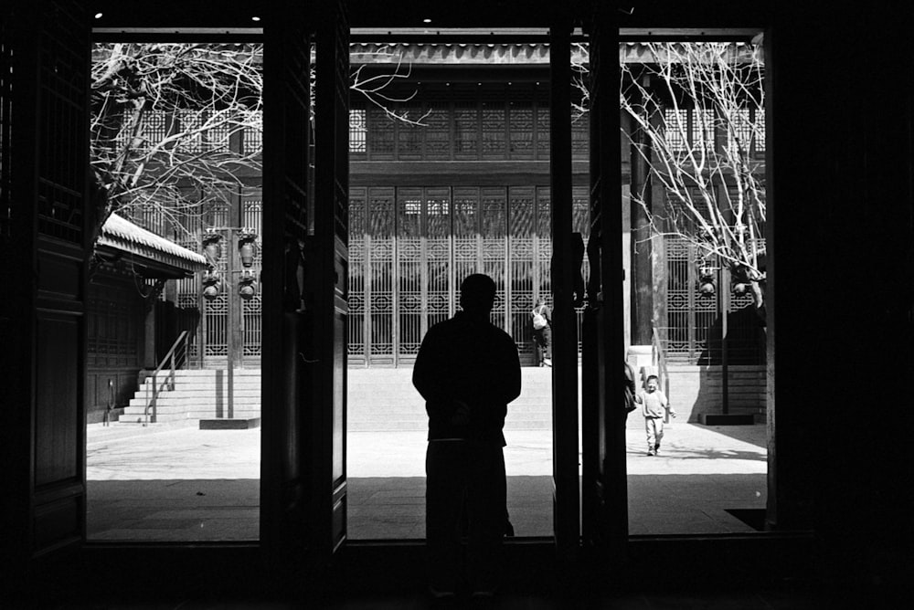 a person standing in front of an open door