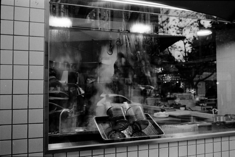 a person standing in front of a store window