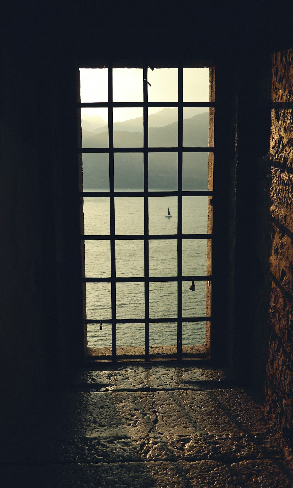 a window with a view of a body of water