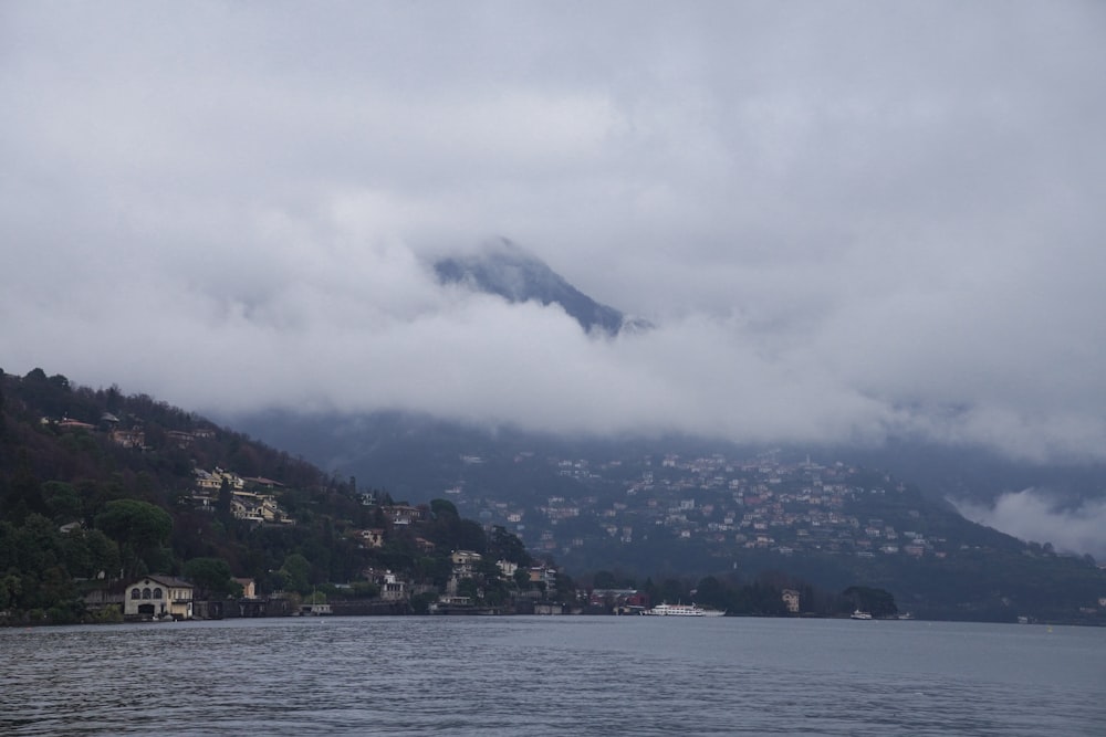 a body of water with a mountain in the background