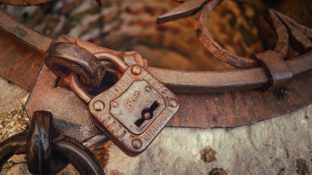 a rusted metal padlock with a horse on it