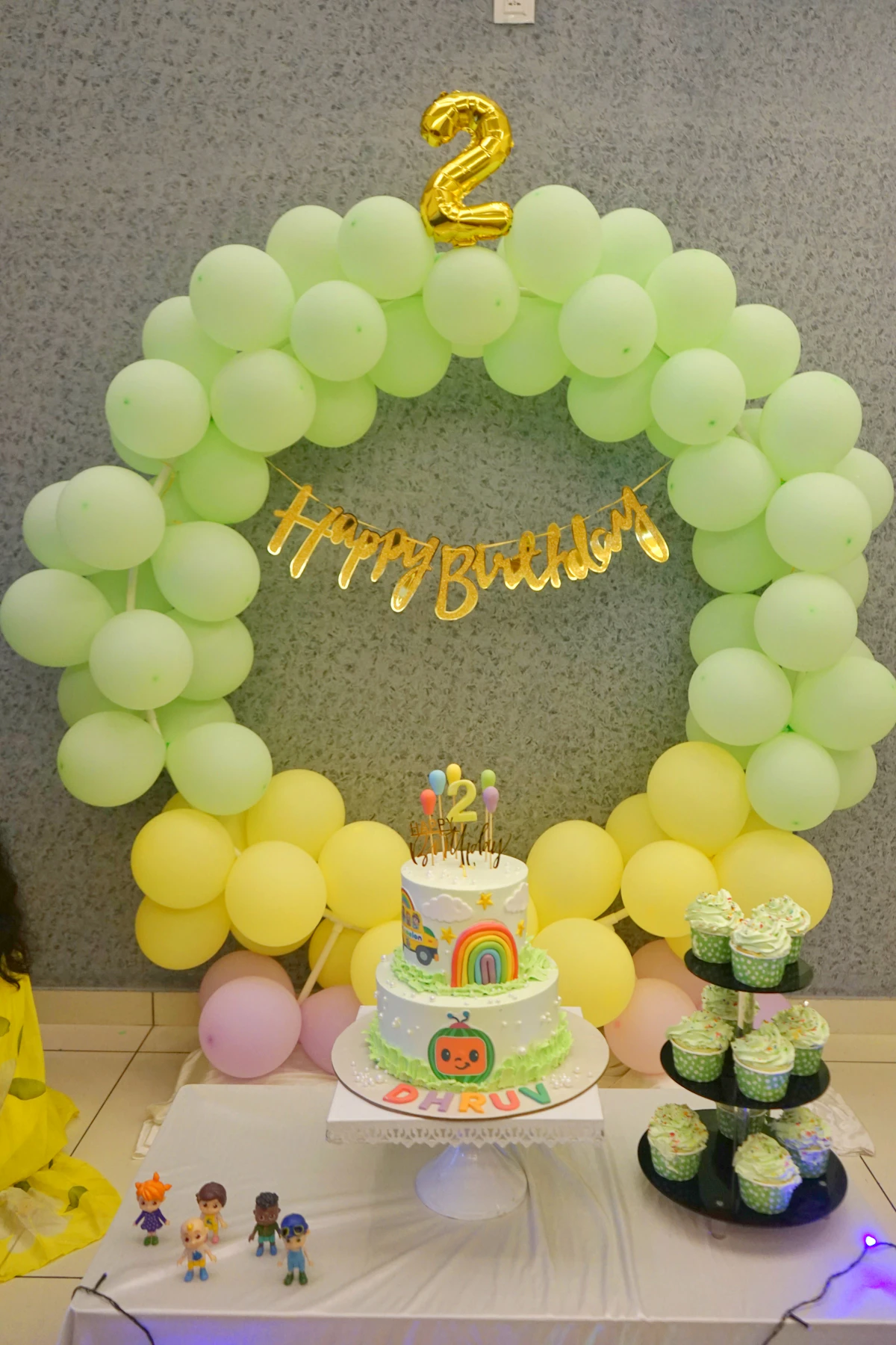 Birthday cake and cupcakes styled for a celebration table