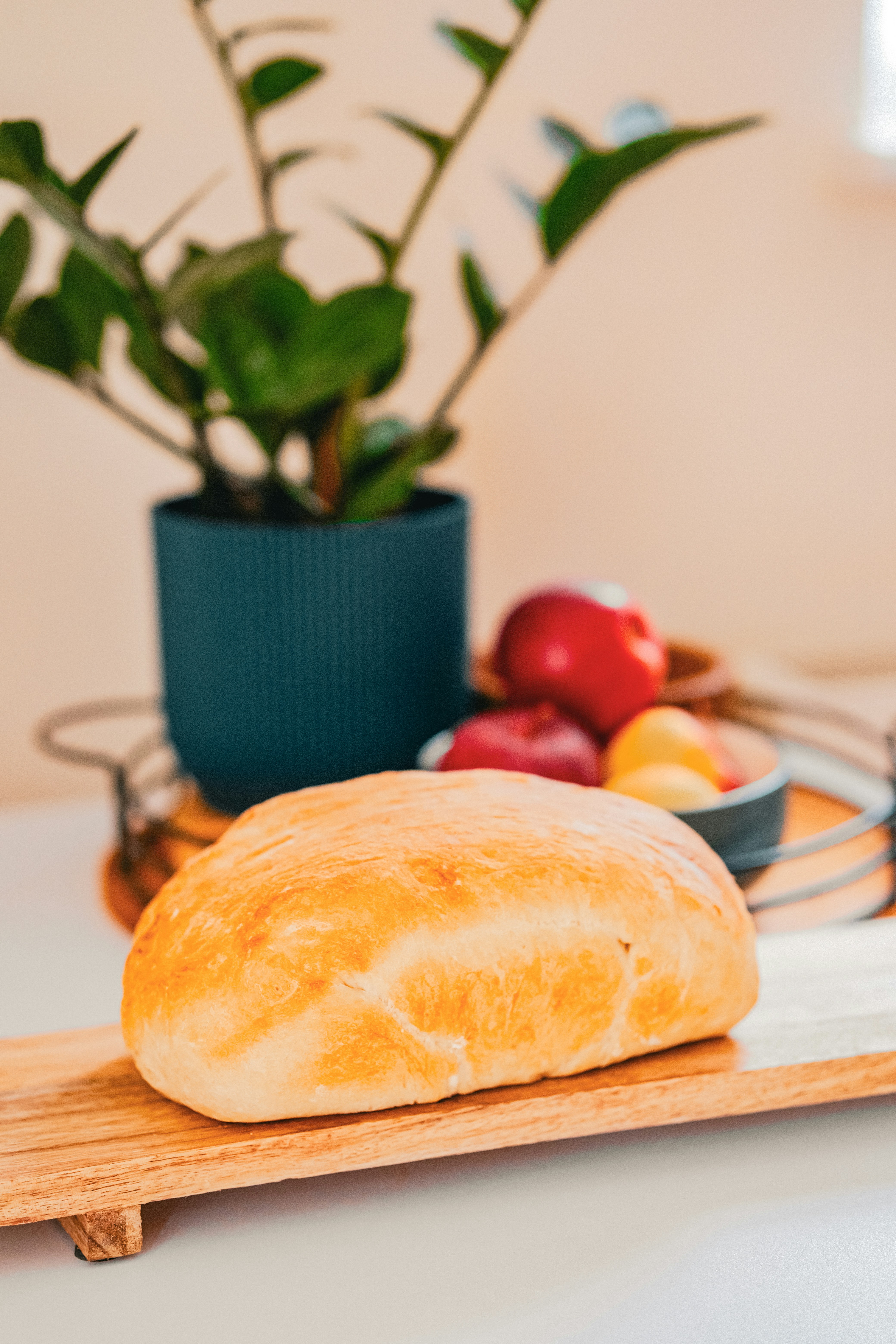 a loaf of bread sitting on top of a cutting board
