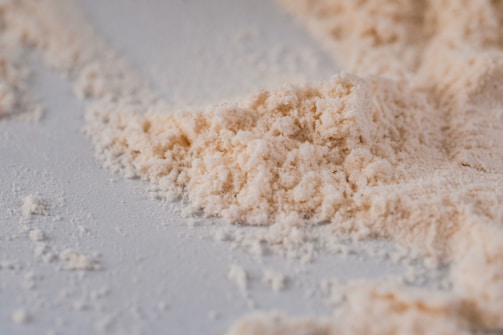 a pile of powdered sugar on a white surface