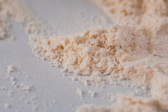 a pile of powdered sugar on a white surface