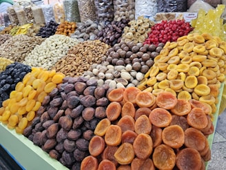 a display of dried fruits and nuts for sale