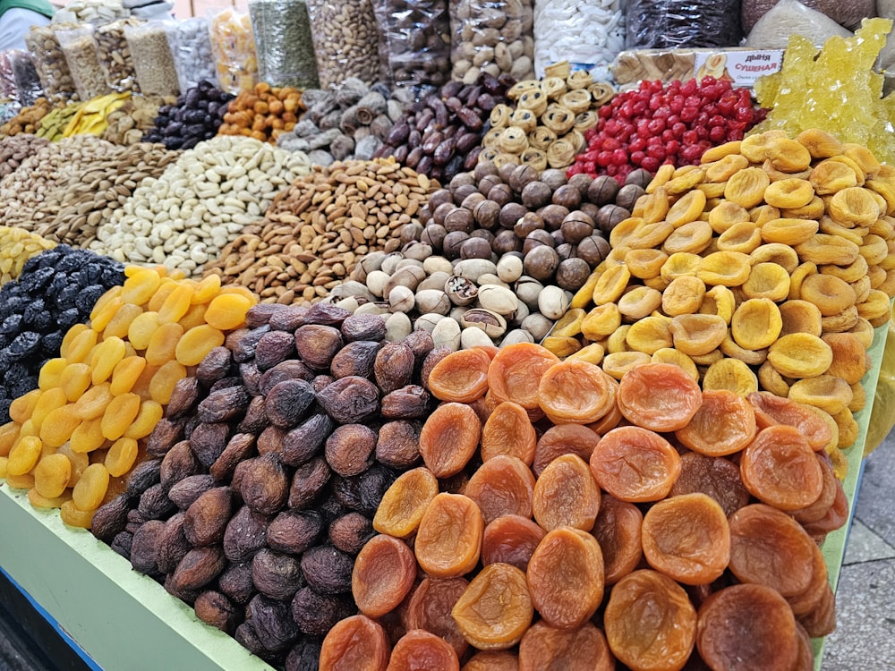 a display of dried fruits and nuts for sale