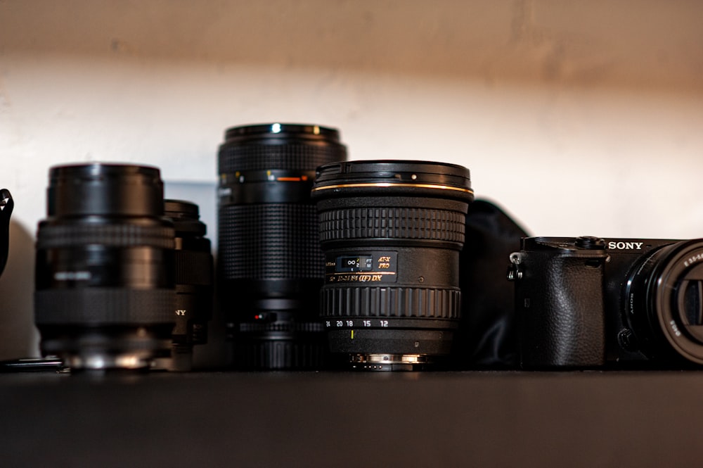 a group of cameras sitting on top of a table