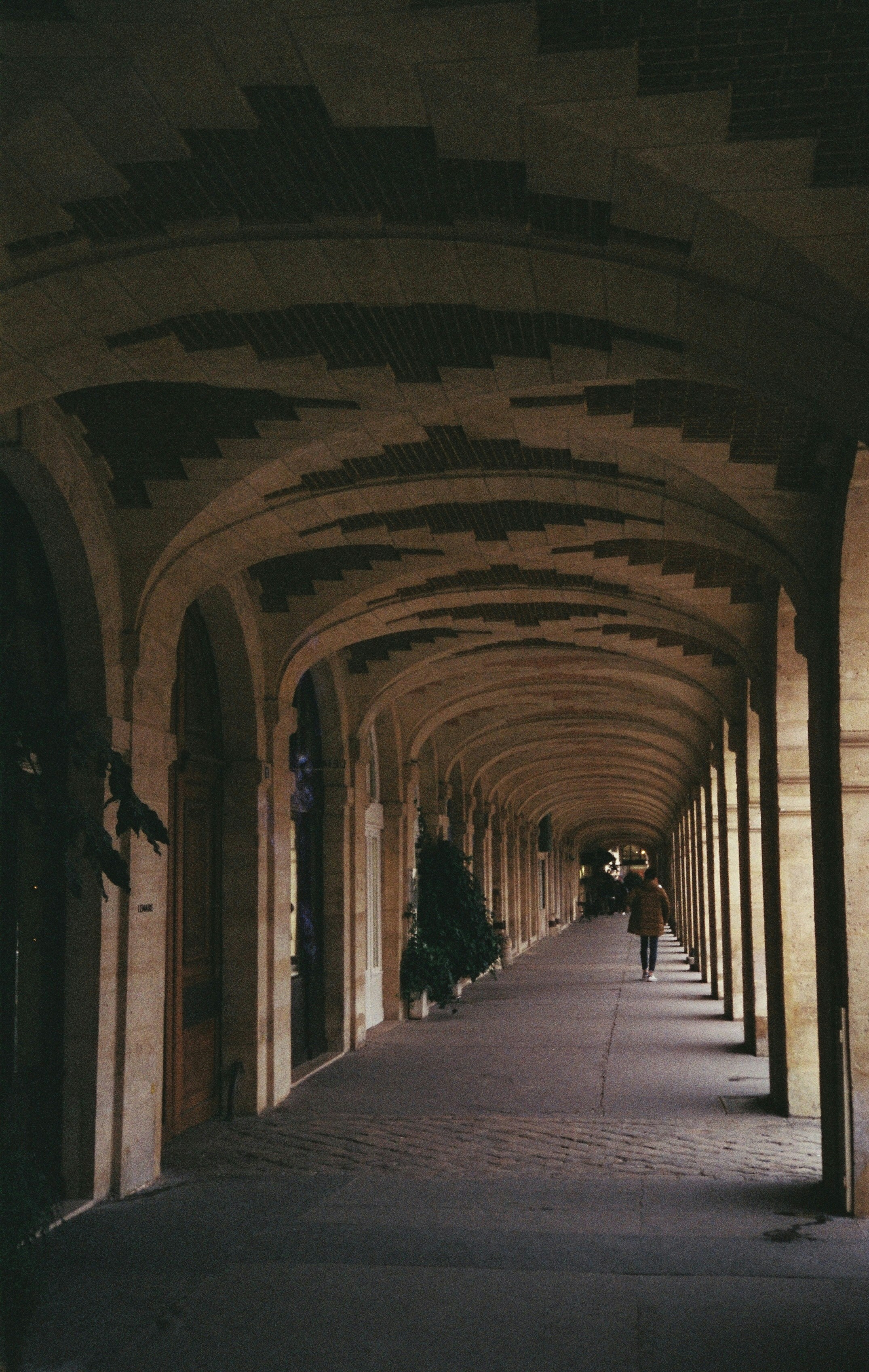 a long hallway with a clock on the side of it