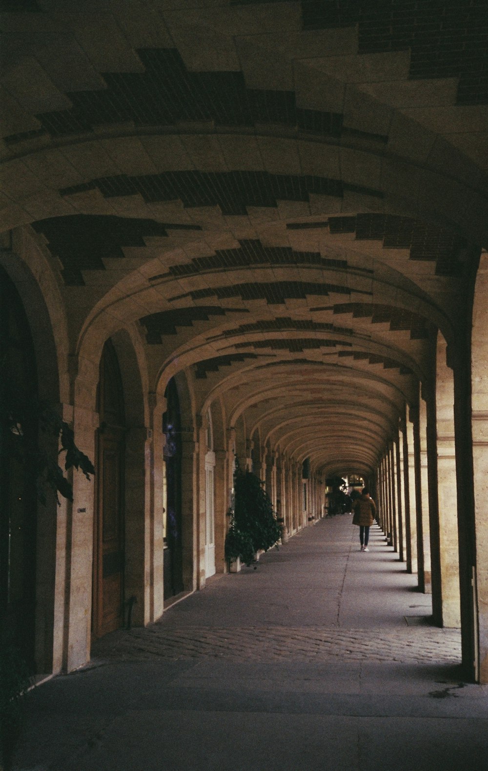 a long hallway with a clock on the side of it