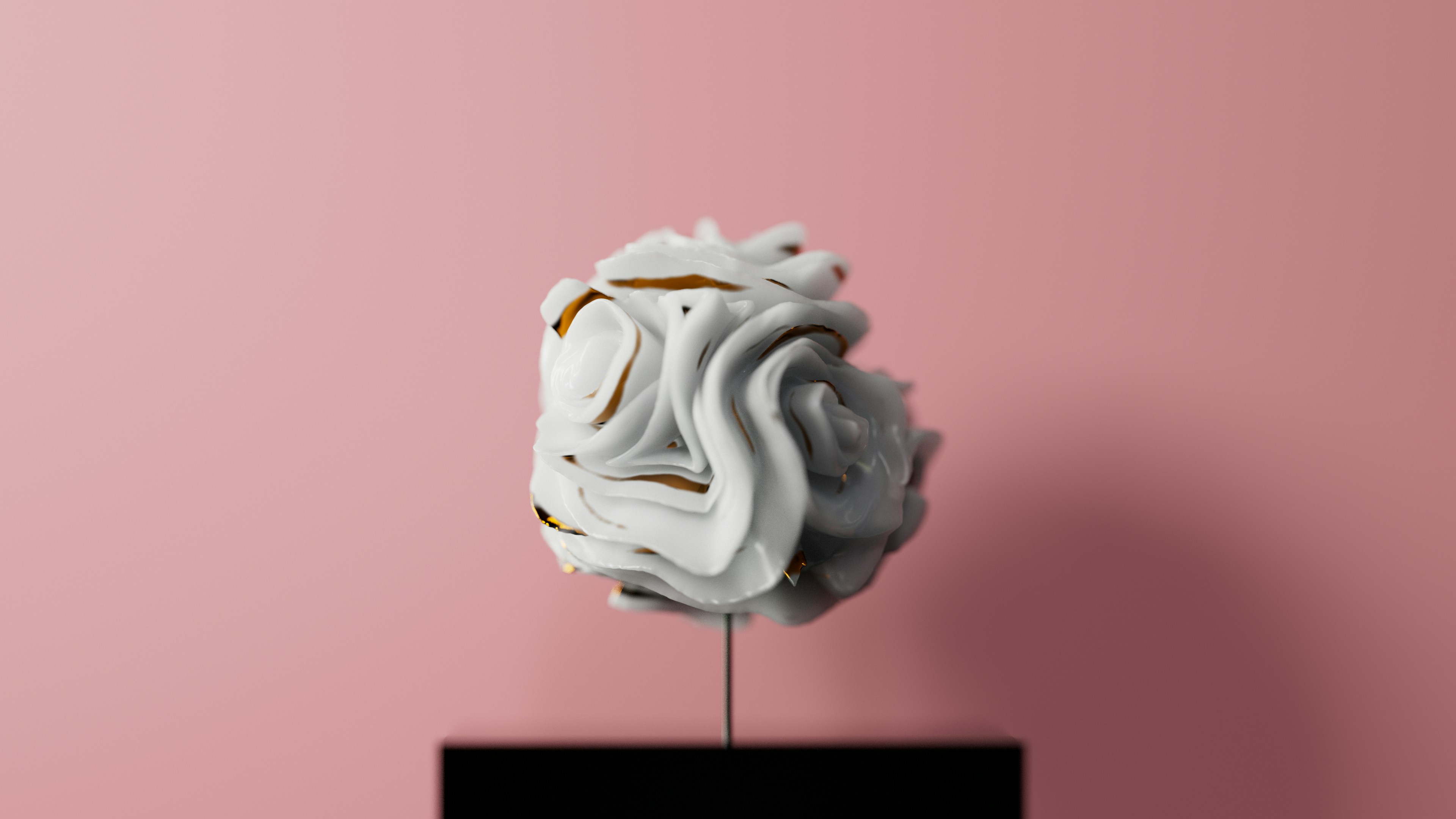 a white sculpture sitting on top of a black stand