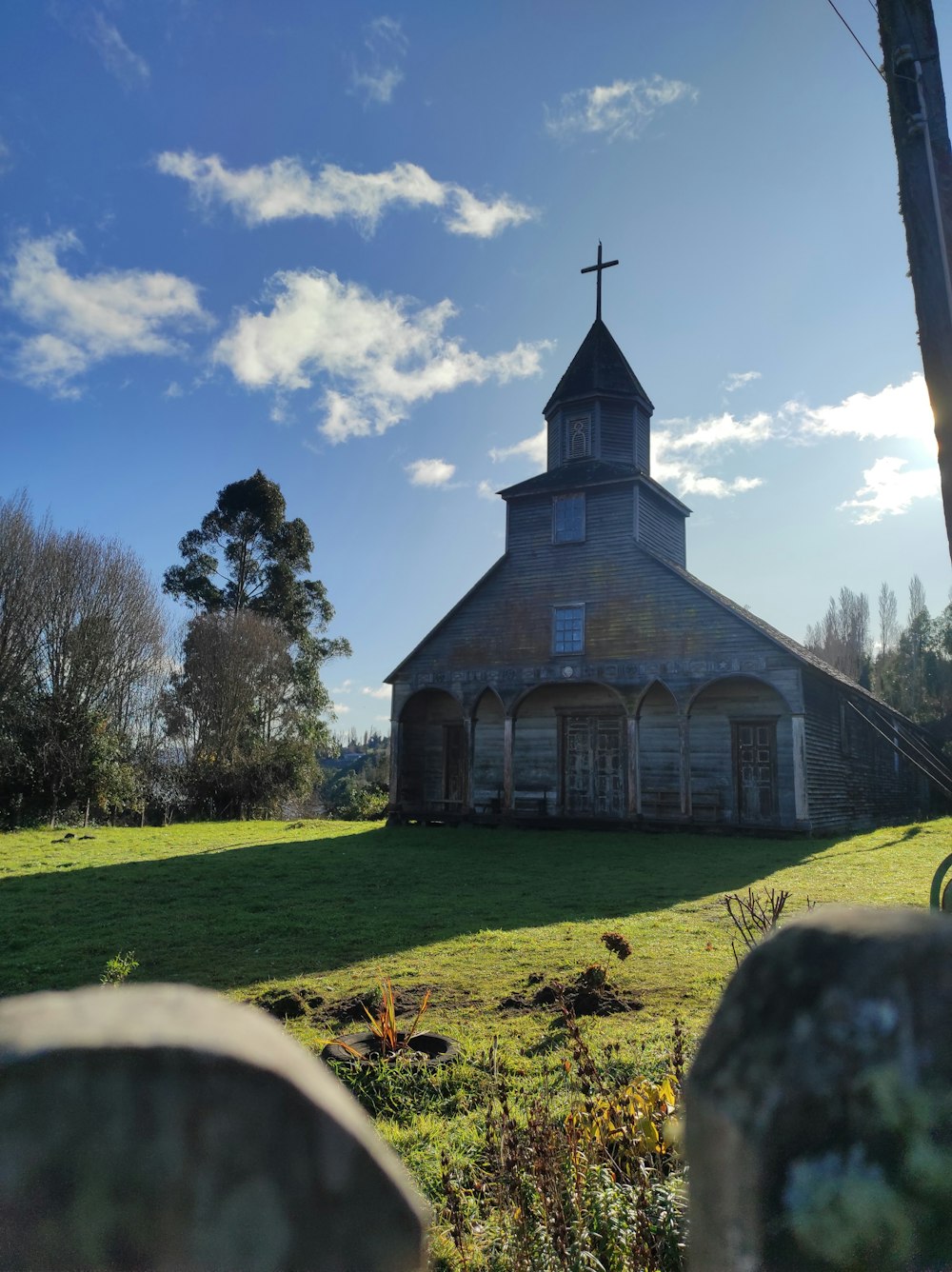 a church with a cross on the top of it