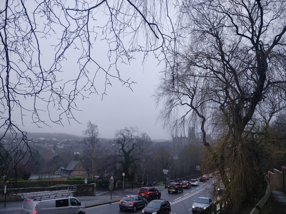 a street filled with lots of traffic on a cloudy day