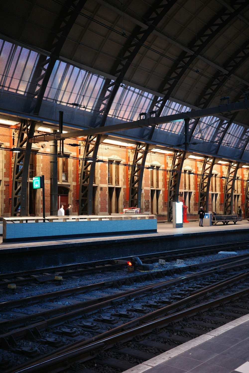 a train station with a train on the tracks