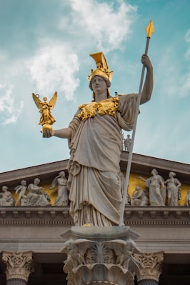 a statue of a lady justice holding a sword