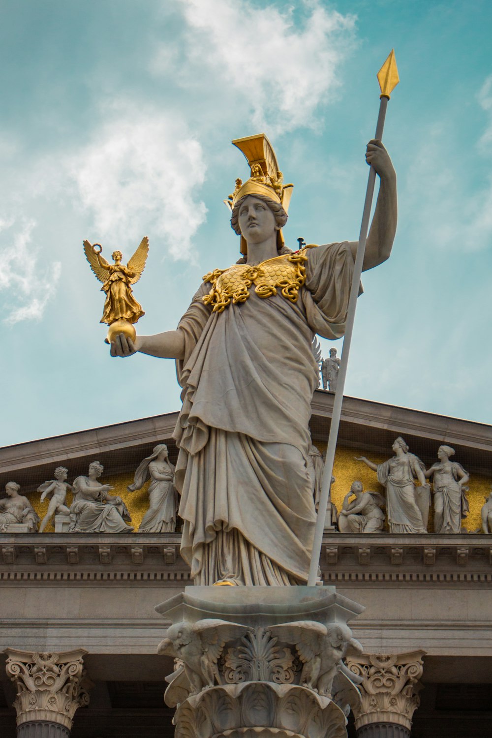 a statue of a lady justice holding a sword
