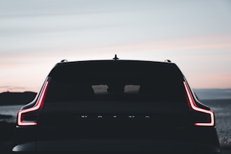 the back end of a car with its lights on