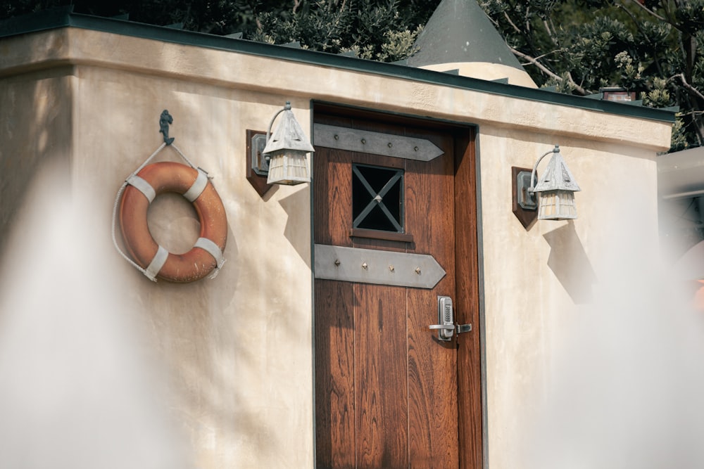 a wooden door with a life preserver on it