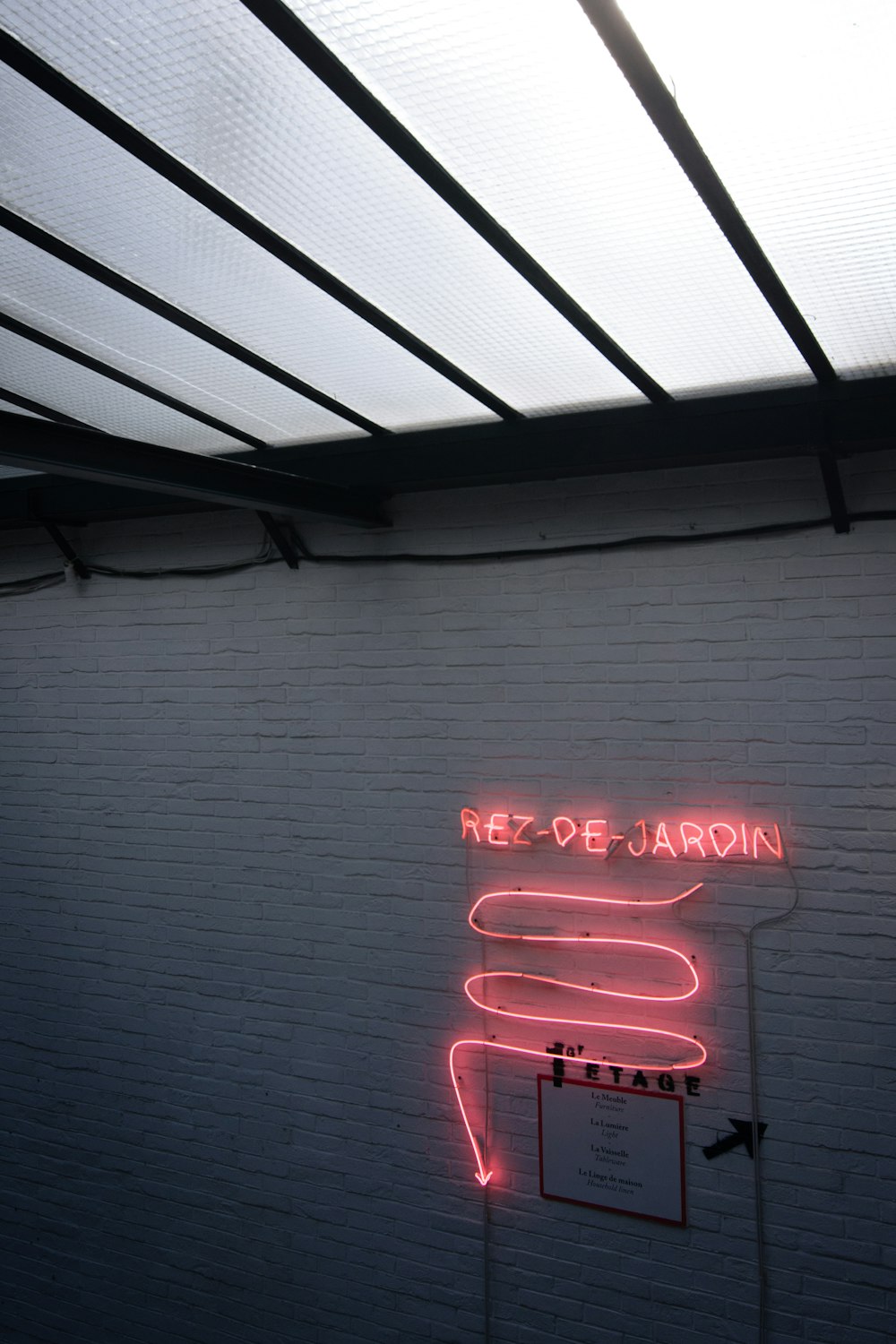 a neon sign on the side of a building