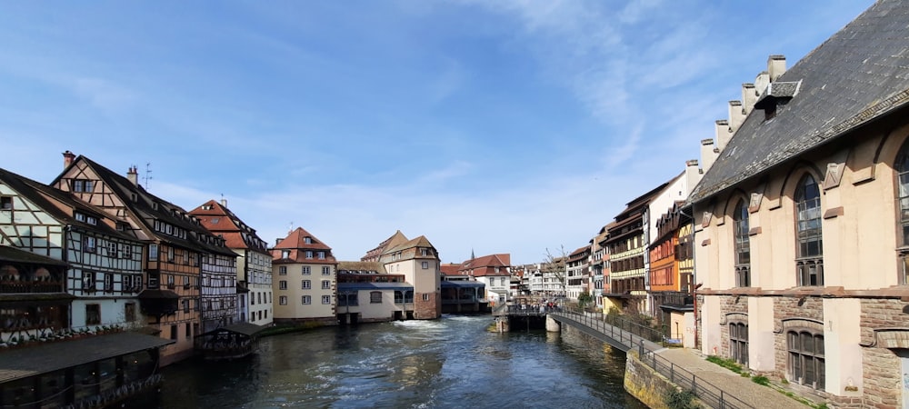 a river running through a city next to tall buildings