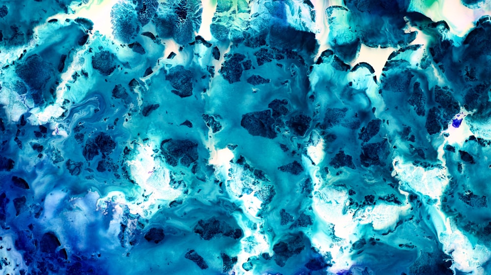 an abstract painting of blue and green colors