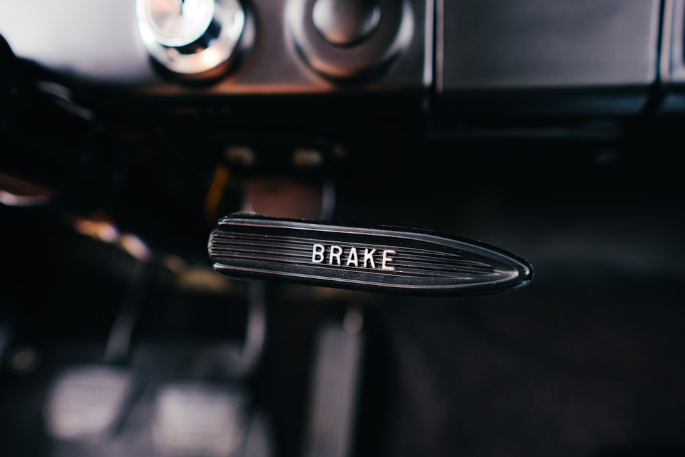 a car door handle with the word brake on it