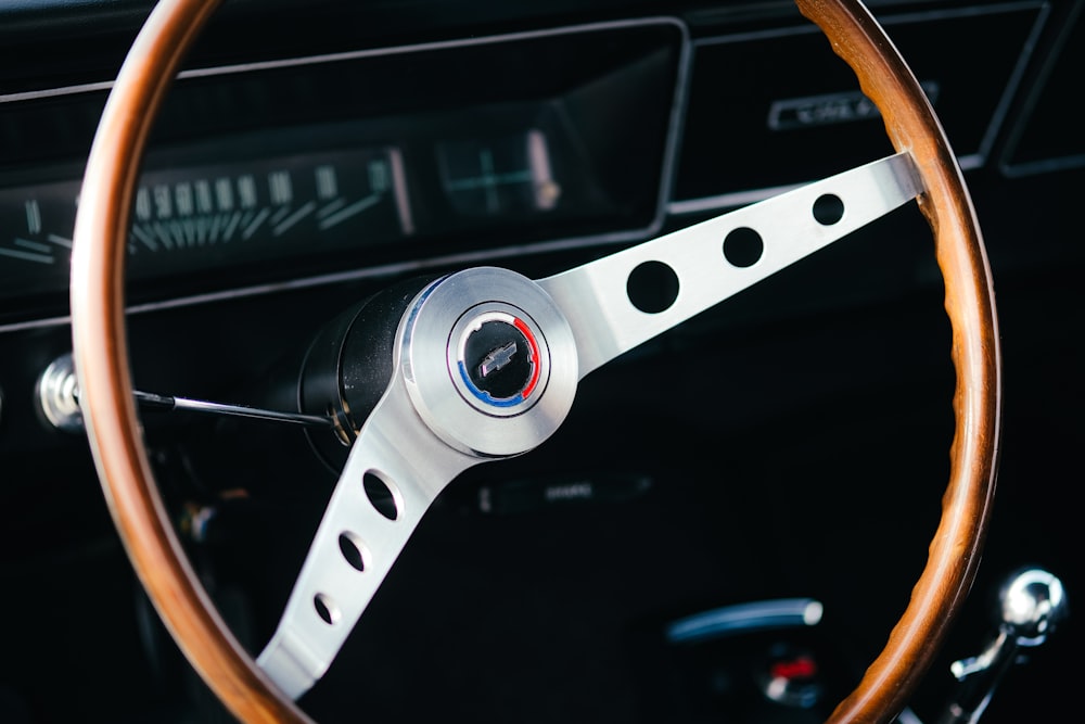 a car steering wheel with a wooden steering wheel