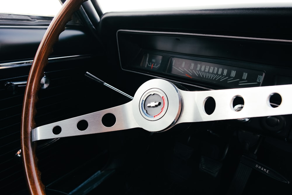 a steering wheel and dashboard of a car