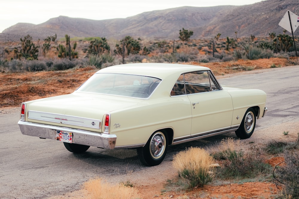 a white car parked on the side of the road