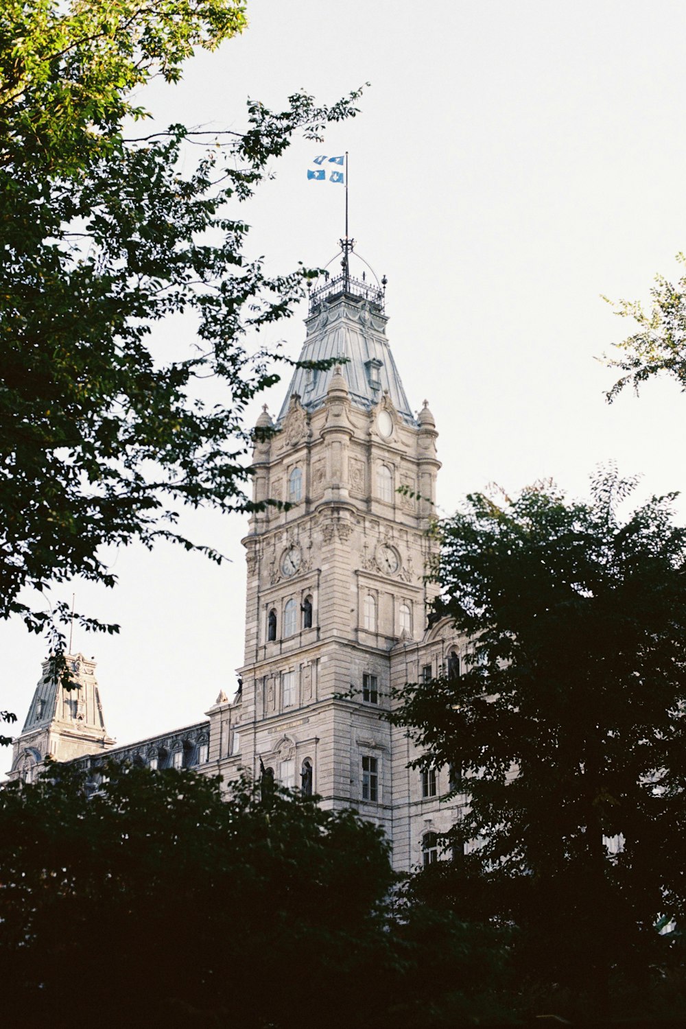 a tall tower with a flag on top of it