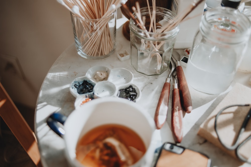 a white table topped with a bowl of food