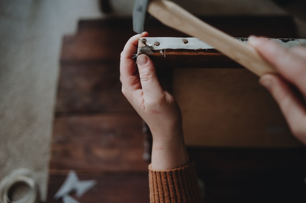 a person holding a knife in their hand