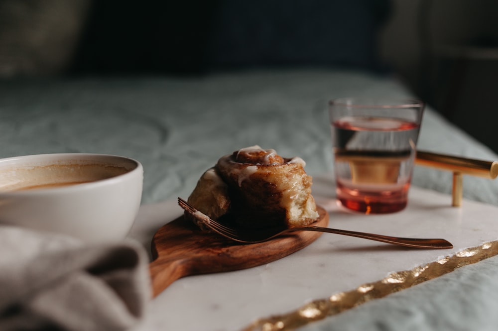 a cup of coffee and a spoon on a table