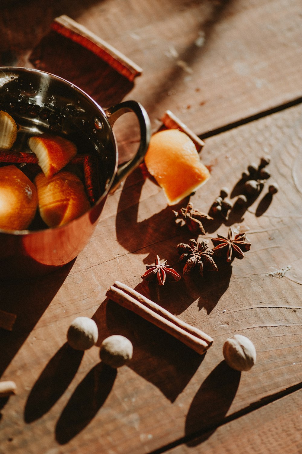 a pot of food sitting on top of a wooden table