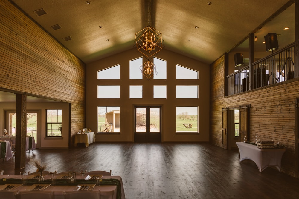 a large room with wooden floors and windows