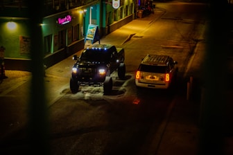 a couple of trucks parked on the side of a road